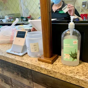 a bottle of salad dressing sitting on a counter