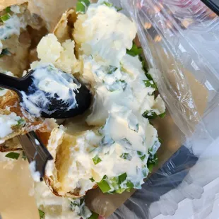 90% of this was covered w/ sour cream. Where is the potato? Also missing butter in it. Took 2 bites &amp; couldn't eat anymore. Too tasteless.