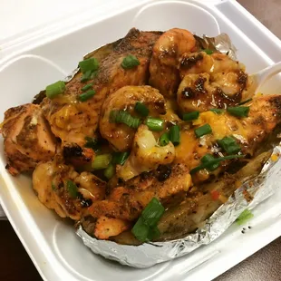 The &quot;Anthony Davis&quot; Spud at Salads Galore in New Orleans East. Salmon and Jumbo Shrimp w| Cheddar served up in a Baked Potato.