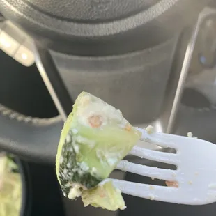 Hard avocados with skin on it still