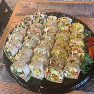 a platter of sandwiches on a table