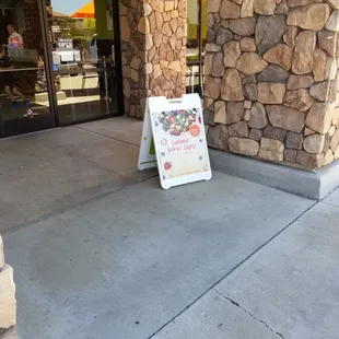 The sandwich board sign at the entrance