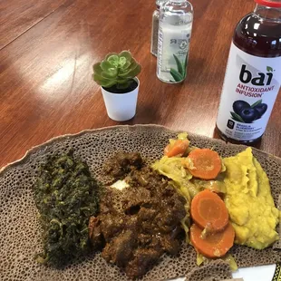 Beef tibs, spinach gomen, alicha w yellow lentils and cabbage w carrots.