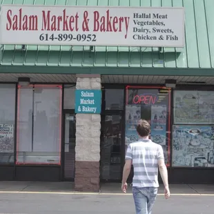a man walking in front of the store