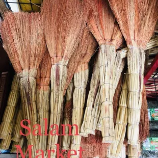 a display of brooms for sale