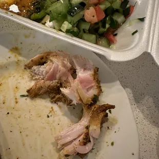 Undercooked chicken and a salad