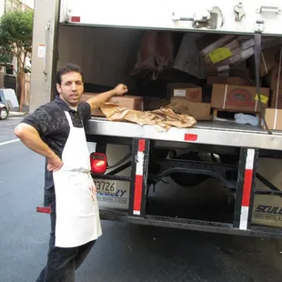 a man standing in front of a truck