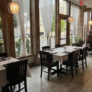 a dining room with tables and chairs