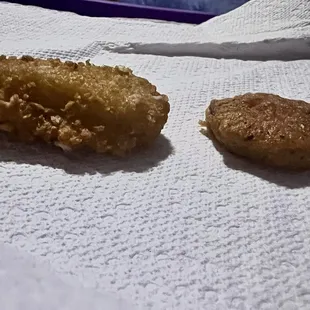 One on right &quot;the other fried pickle&quot;   One on left, Salas fried oickle