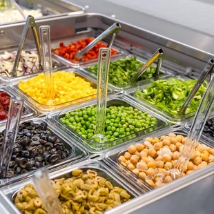 a variety of olives, peas, and other vegetables