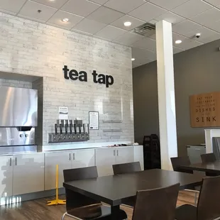 a table and chairs in a tea tap