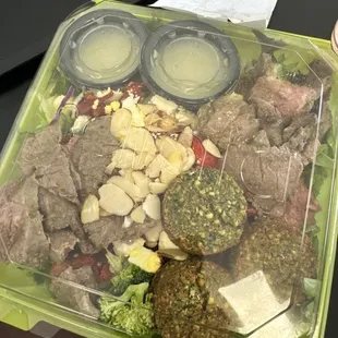 Custom salad with grilled steak and falafel