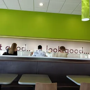 More customers in the middle of choosing their toppings