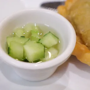 Cucumber salad served with the empanadas