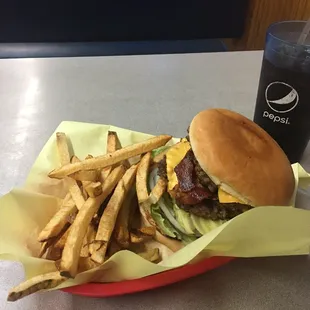 Double cheese bacon burger with avocados, TLPO, mayo, mustard and ketchup ! Also a side of fries !