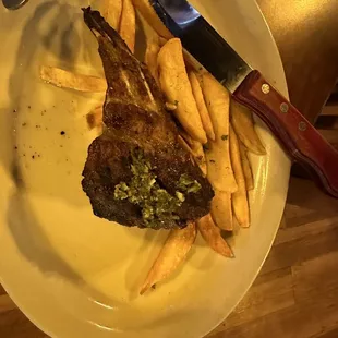 A side lamb chop with steak fries