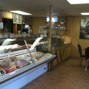 a deli counter with a variety of pastries