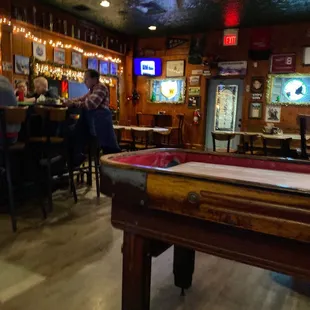 a pool table in a bar