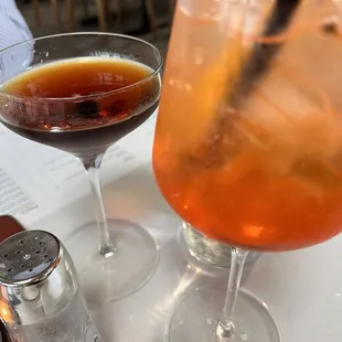 Aperol Spritz and a bourbon cocktail