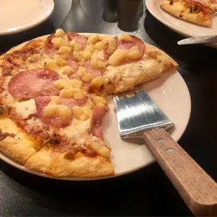 All we can say is WOW!  This is a what they say is a small Canadian Bacon and pineapple pizza only $12 dollars, $10 dollars if just cheese.