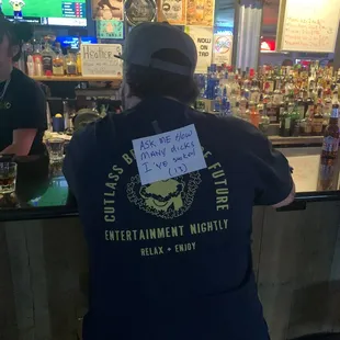 a man with a sign on his back