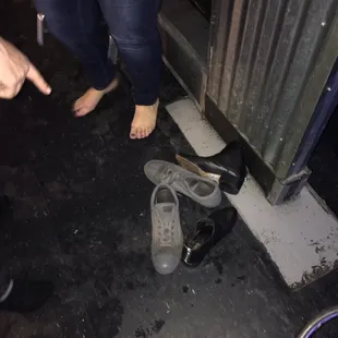 a pair of shoes left on the floor