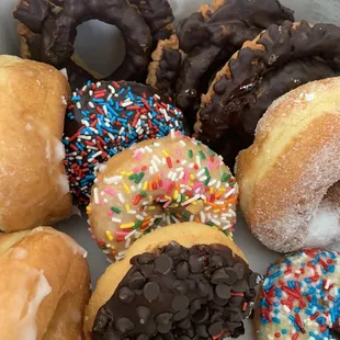 I bought a dozen donuts today. Some with sprinkles, old fashion, sugar and glazed