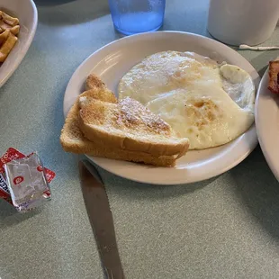 Chicken fried steak came with eggs and toast.