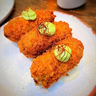 a plate of food with avocado on top