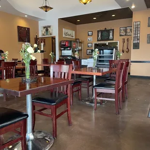 a dining area with tables and chairs