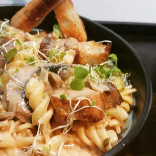 a pasta dish with meat and vegetables