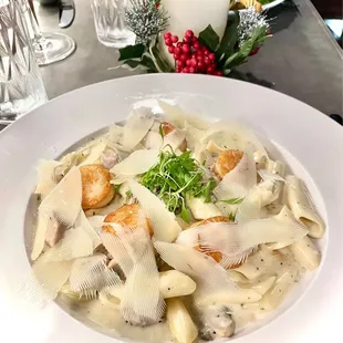 a plate of pasta with meat and cheese