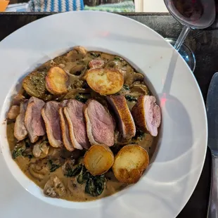 SPECIAL: DUCK BREAST WITH BRANDY CREAM, MUSHROOMS, BACON, SPINACH, AND PETITE POTATOES.