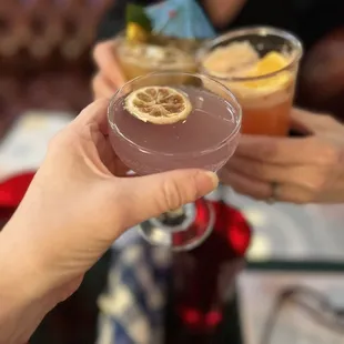 a group of people toasting with drinks