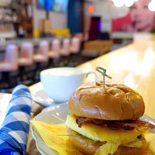 Breakfast Sandwich: egg soufflé, bacon, pepper jelly, challah ($8 prior to 10 AM brunch, $10 otherwise). Substitute vegan sausage for $3.