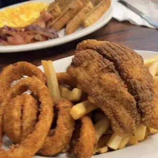 Catfish, fries and onion rings. French toast, bacon and eggs.