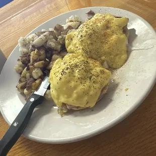 Uncooked English muffin eggs, Benedict with ice, cold home fries and over seasoned with Italian spice area