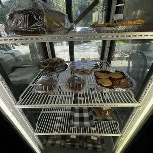 Bakery items in the front case near the register, outdoor exterior signage.
