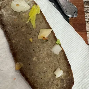 Wonderful dry ass gyro meat with tomato seeds on it.