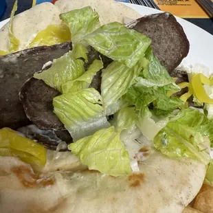 Dry ass gyro sloppy display of appetizing food.