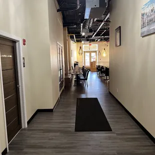 Hallway from bathroom leading back to dining area