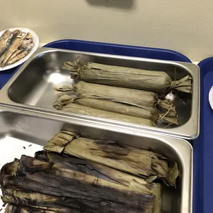 a tray of grilled corn