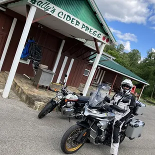 two motorcycles parked in front of a building