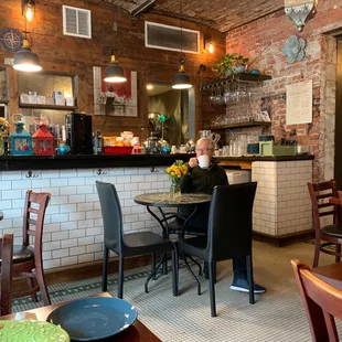 a man sitting at a table in a restaurant