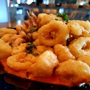 Flash fried semolina crusted calamari.