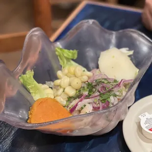 a salad in a plastic bowl