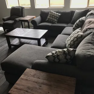 Reclining chair, sectional, coffee table, pillows and throw.
