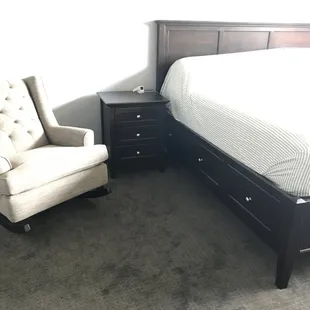 Rocking chair, king bed, night stand.