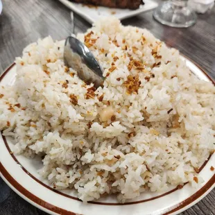 a plate of rice and meat