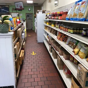 a grocery store aisle with food on shelves